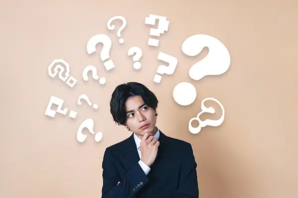 マンション買い替えに関する疑問を持つ男性